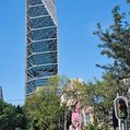 a large skyscraper with a slanted triangular shape on one side