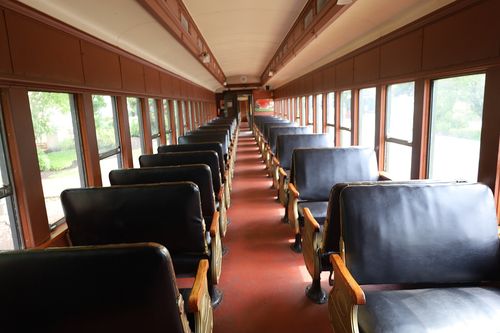 many train cars with light shining through the windows