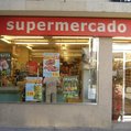 a storefront labeled supermercado