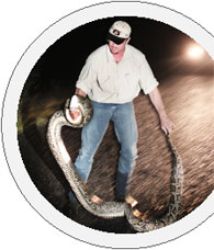 Man holding snake python